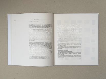 Open spread from Yamamoto Masao with a text essay printed across two white pages.