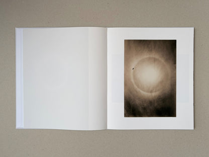 Yamamoto Masao photobook open to a spread with a blank left page and a sepia-toned image on the right page.