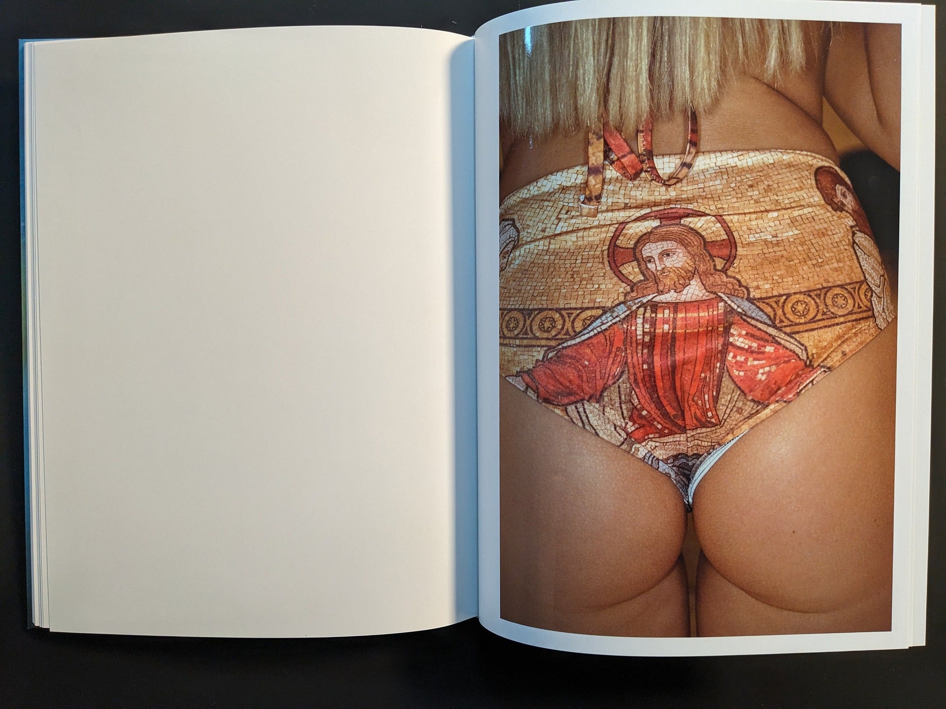 Inside page from “¥€$U$ (JESUS)” showing a close-up of a person’s lower torso wearing patterned swimwear printed with an icon-style image of Jesus.