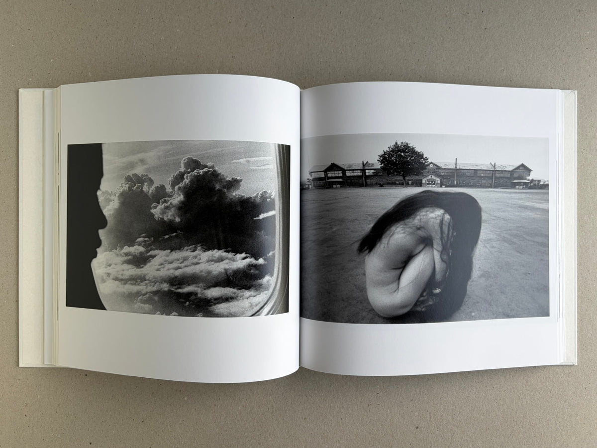 Yoko – Masahisa Fukase, spread with a raven silhouette over clouds on the left and Yoko Miyoshi crouched outdoors on the right.