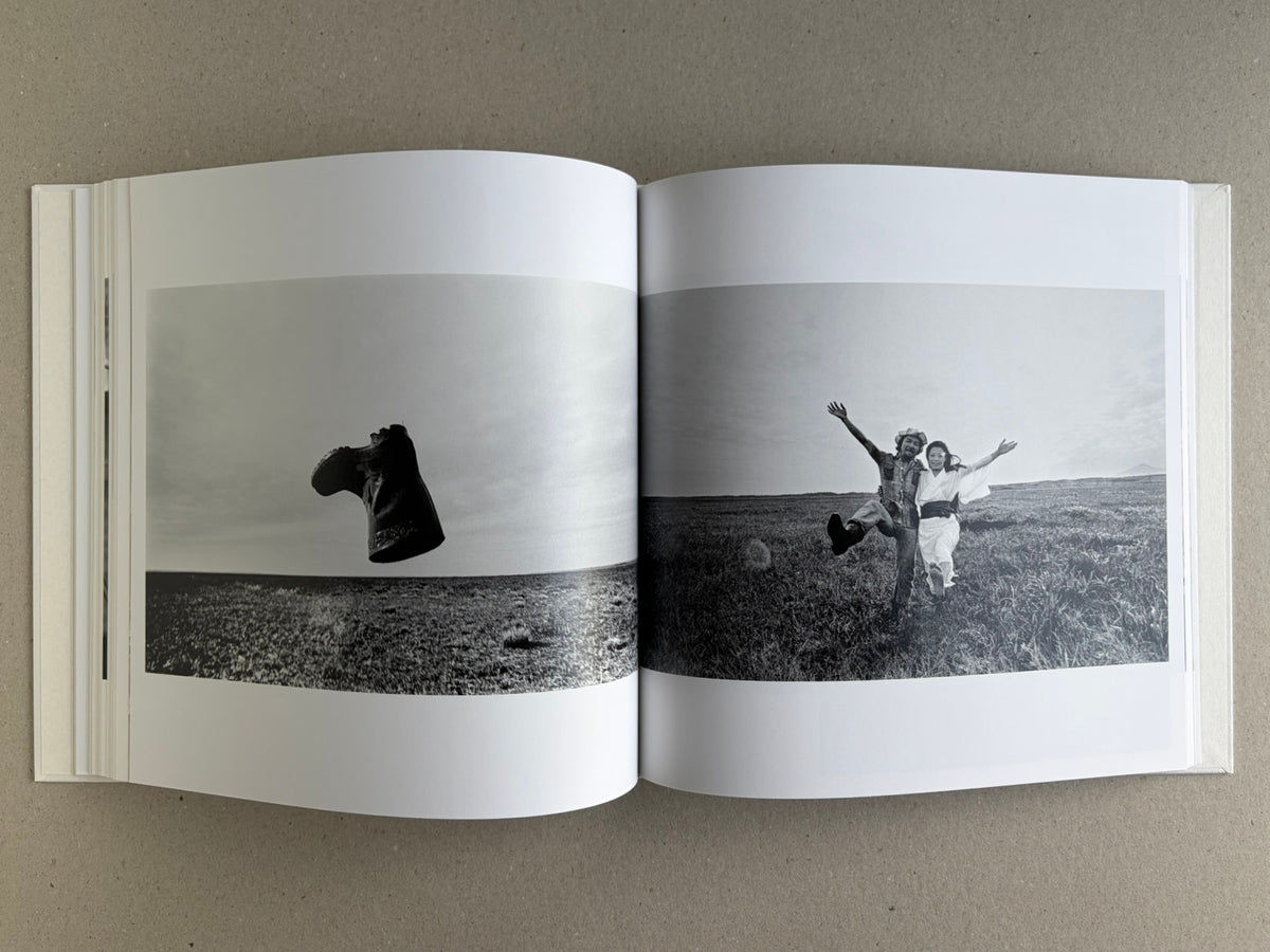 Yoko – Masahisa Fukase, spread with a raven silhouette in the left image and a couple running through a field on the right.