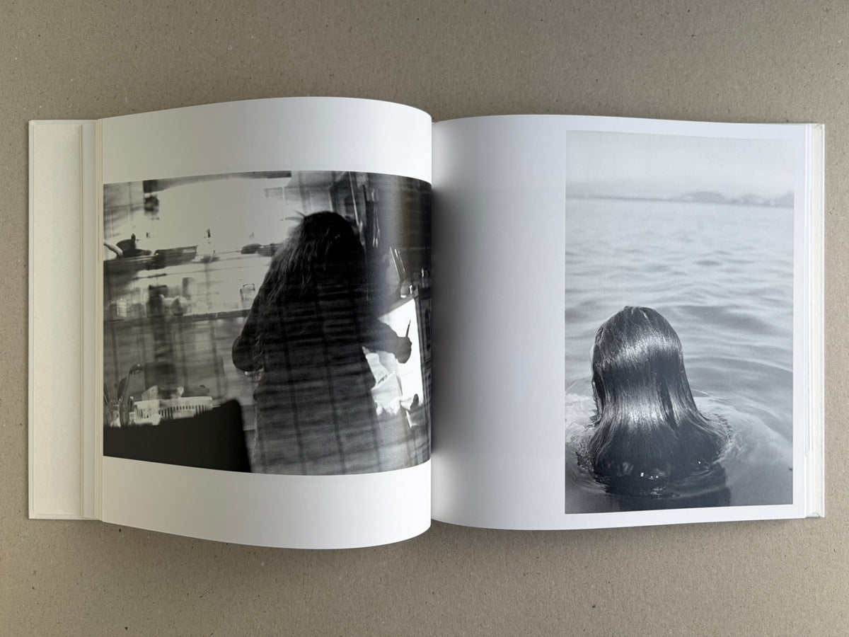 Yoko – Masahisa Fukase, spread with a blurred interior scene on the left and Yoko Miyoshi seen from behind in water on the right.