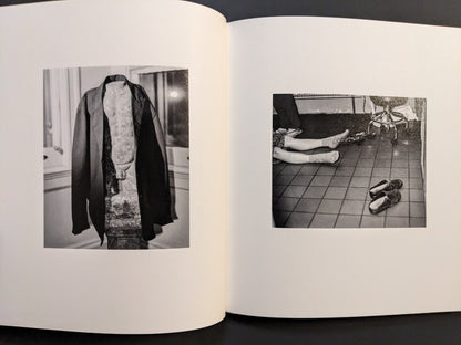 Black-and-white photographs showing a tiled interior scene and a veiled statue from i shall sing these songs beautifully.