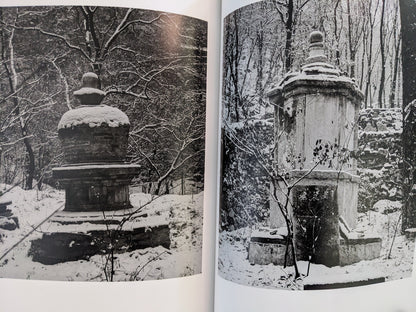 Spread from The Ancient Towers featuring images of stone towers partially covered in snow.